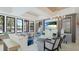 Beautifully decorated lounge area featuring comfortable seating, a large screen television, and a view of the pool at 5327 Olano St, Palmetto, FL 34221
