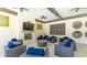 Inviting lounge area with cozy seating, a fireplace, ceiling fans, and a flat-screen TV for relaxation and entertainment at 5327 Olano St, Palmetto, FL 34221