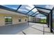 The open patio features an outdoor ceiling fan and an unobstructed view of the beautiful pond at 5327 Olano St, Palmetto, FL 34221