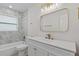 Stylish bathroom with marble tile, contemporary fixtures, and ample natural light at 5718 Magnolia N St, St Petersburg, FL 33703