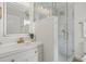 Elegantly renovated bathroom featuring marble-look tile and modern gold fixtures at 5718 Magnolia N St, St Petersburg, FL 33703