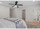 Bedroom featuring neutral tones, a ceiling fan, and ensuite bath and closet entries at 5718 Magnolia N St, St Petersburg, FL 33703