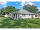 Charming single-story home with well-maintained lawn and fresh landscaping at 5718 Magnolia N St, St Petersburg, FL 33703