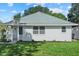Charming single-story home with a well-manicured lawn and freshly planted landscaping at 5718 Magnolia N St, St Petersburg, FL 33703