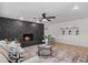 Cozy living room featuring a striking black stone fireplace and stylish decor at 5718 Magnolia N St, St Petersburg, FL 33703
