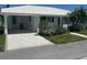 Inviting home with covered parking, white tile roof, and well-maintained landscaping at 675 El Centro # 675, Longboat Key, FL 34228