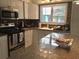 Modern kitchen features granite countertops and stainless steel appliances at 675 El Centro # 675, Longboat Key, FL 34228