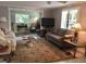 Cozy living room with comfortable seating and abundant natural light at 675 El Centro # 675, Longboat Key, FL 34228