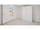 The carpeted bedroom has a white closet at 6961 Alken Cir, New Port Richey, FL 34653