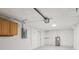 This finished garage includes cabinets, utility sink, and water heater at 6961 Alken Cir, New Port Richey, FL 34653