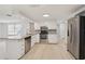 Updated kitchen with stainless steel appliances, granite countertops, and ample cabinet space at 6961 Alken Cir, New Port Richey, FL 34653
