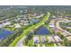 Stunning aerial view of a well-maintained community with lush greenery, serene lakes, and beautiful homes at 7005 Goldrush Ln, Bradenton, FL 34201