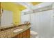 Bright bathroom with colorful countertop, updated fixtures, and shower-tub combination at 7005 Goldrush Ln, Bradenton, FL 34201