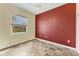 Cozy bedroom with neutral walls, large window, and decorative flooring at 7005 Goldrush Ln, Bradenton, FL 34201
