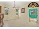 Sunny dining area featuring tile floors, neutral walls, and views to the adjacent living spaces at 7005 Goldrush Ln, Bradenton, FL 34201