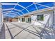 Home exterior featuring a large screened lanai, perfect for enjoying outdoor living at 7005 Goldrush Ln, Bradenton, FL 34201