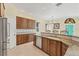 Spacious kitchen with granite countertops, custom cabinetry, and stainless steel appliances at 7005 Goldrush Ln, Bradenton, FL 34201