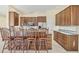 Inviting kitchen with granite counters, stainless steel appliances, and dark wood cabinetry at 7005 Goldrush Ln, Bradenton, FL 34201