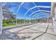 Enjoy serene water views from this large screened lanai, perfect for outdoor gatherings at 7005 Goldrush Ln, Bradenton, FL 34201
