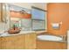 Spa-like primary bathroom featuring soaking tub, custom vanity, and stylish finishes at 7005 Goldrush Ln, Bradenton, FL 34201