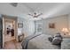 This bedroom offers a ceiling fan, closet and a window with plantation shutters for an airy atmosphere at 8755 Dolomite Ave, North Port, FL 34287