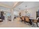 Open-concept home with dining room, living room, and kitchen at 8755 Dolomite Ave, North Port, FL 34287
