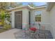 Inviting front porch with seating and decorative accents, perfect for relaxing at 8755 Dolomite Ave, North Port, FL 34287