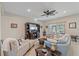 Comfortable living room with stylish furnishings, natural light, and views to the backyard at 8755 Dolomite Ave, North Port, FL 34287