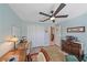 Home office featuring a ceiling fan, and desk area creating an efficient workspace at 8755 Dolomite Ave, North Port, FL 34287