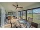 This sunroom offers tile floors, lots of windows, and views of the outdoors at 8755 Dolomite Ave, North Port, FL 34287