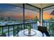 Balcony view with colorful sunset skies, seating, and ocean views at 925 Beach Rd # 408, Sarasota, FL 34242