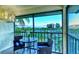 Inviting balcony area featuring comfortable seating and stunning views of the landscape, beach and blue ocean at 925 Beach Rd # 408, Sarasota, FL 34242