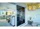 Balcony looking out to living area with lanterns and table with seating at 925 Beach Rd # 408, Sarasota, FL 34242