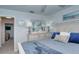 Inviting bedroom with a serene color palette, dresser, and view into the hallway at 925 Beach Rd # 408, Sarasota, FL 34242