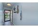 Welcoming entryway with stylish decor and a glimpse of the beautiful beach view from the doorway at 925 Beach Rd # 408, Sarasota, FL 34242