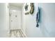 Hallway with coastal themed decor and wood-look flooring at 925 Beach Rd # 408, Sarasota, FL 34242