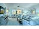 Bright open-concept living room showcasing dining area, comfortable seating, stylish decor and an inviting space at 925 Beach Rd # 408, Sarasota, FL 34242