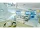 Living room with open floor plan, view of balcony and outdoor scenery at 925 Beach Rd # 408, Sarasota, FL 34242