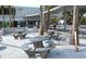 Outdoor picnic tables in a shaded area, perfect for enjoying meals by the beach at 925 Beach Rd # 408, Sarasota, FL 34242