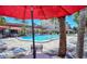 Community pool with ample seating and tables for relaxing by the water at 925 Beach Rd # 408, Sarasota, FL 34242
