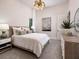 Well-lit bedroom featuring a stylish bed, modern decor, and plenty of natural light with neutral wall coloring at 1166 Blue Shell Loop, Sarasota, FL 34240