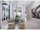 Bright dining area with water views, modern decor, and comfortable seating, ideal for gatherings at 1166 Blue Shell Loop, Sarasota, FL 34240