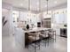Spacious kitchen features a large center island, modern appliances, and ample counter space for cooking at 1166 Blue Shell Loop, Sarasota, FL 34240