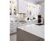 This stylish kitchen features an oversized island, custom cabinets, and modern appliances at 1166 Blue Shell Loop, Sarasota, FL 34240