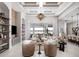 Bright open-concept living room offers water views, neutral tones, and modern decor, creating a luxurious space at 1166 Blue Shell Loop, Sarasota, FL 34240
