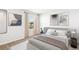 Relaxing bedroom featuring a plush bed, modern decor, and a tranquil view of the nearby pond at 17386 Whiskey Creek Trl, Parrish, FL 34219