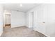 Neutral bedroom with carpet, natural light, and access to closet and doorways at 17386 Whiskey Creek Trl, Parrish, FL 34219