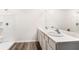 Bathroom showcasing a double sink vanity with sleek countertop and a modern shower cabin at 1774 Cobb Trl, Parrish, FL 34219