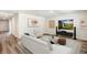Beautifully staged living room with sleek furniture, stylish decor, and abundant natural light at 1774 Cobb Trl, Parrish, FL 34219