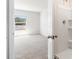 Bathroom entry with view to window and shower at 1926 Cobb Trl, Parrish, FL 34219